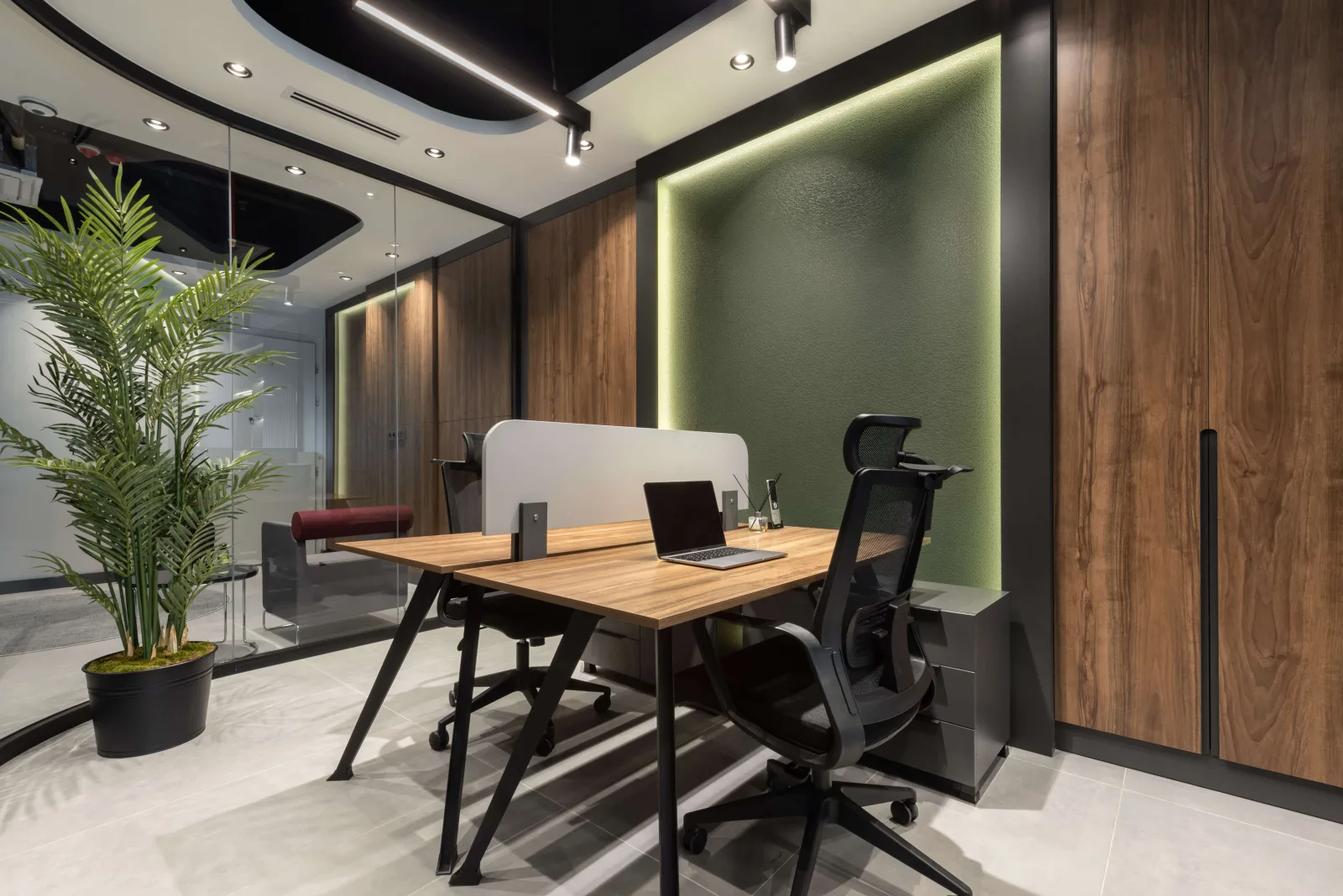 As a corporate interior architecture firm, we skillfully integrated curved and organic forms into custom furniture dividers…