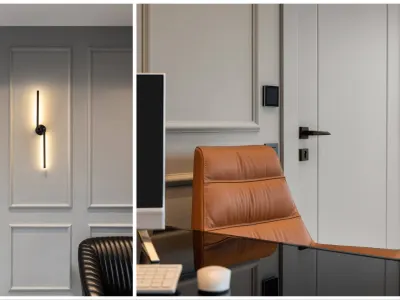 Within the scope of executive office decoration, we created an aesthetic and functional ambiance in this special area by incorporating black sconce details positioned against the grey wall surfaces. We enriched the calming and sophisticated effect of neutral grey undertones with the sharp contrast created by black fixtures. The minimalist and contemporary forms of our sconces seamlessly complement the overall design language of the space. The depth perception generated by the black color on architectural surfaces highlights the corporate prestige of the executive room while allowing us to curate a balanced color palette. These sophisticated lighting elements eliminate monotony on the wall facades, creating an impressive focal point. The indirect light diffusing from the fixtures elevates the overall atmosphere of the volume to a warm and inviting dimension. This elegant harmony of grey and black imparts a balanced character to the architectural layout of the space, offering a professional working environment. Thus, we have designed a unique space where our users can simultaneously experience both an authoritative stance and high-level comfort.